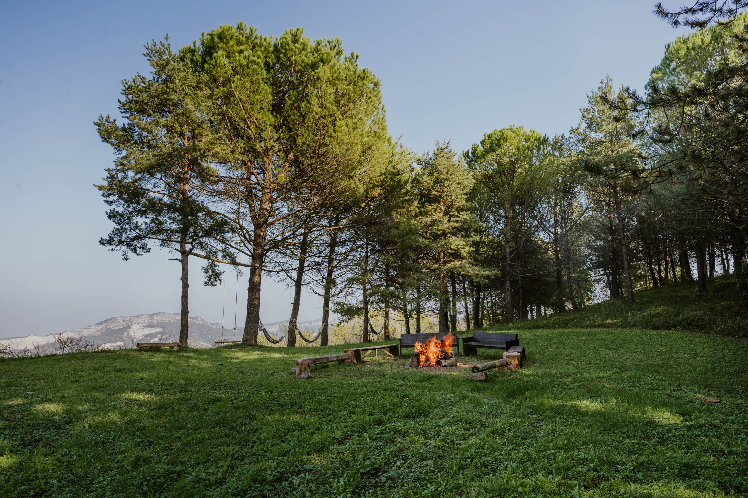 The garden firepit with seating, hammocks and mountain views